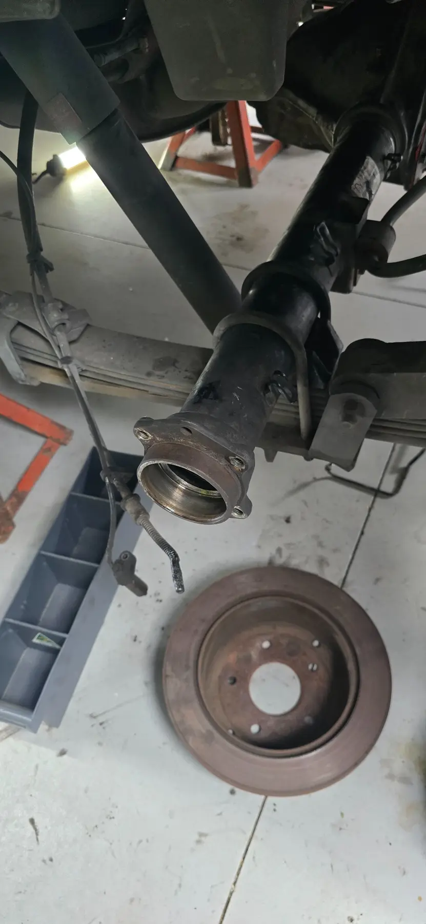 Rear axle and hub area with brake rotor removed during Mobile Motive repair work